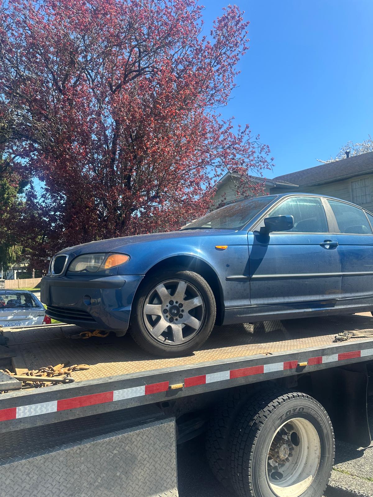 Damaged junk car ready for scrap vehicle pickup